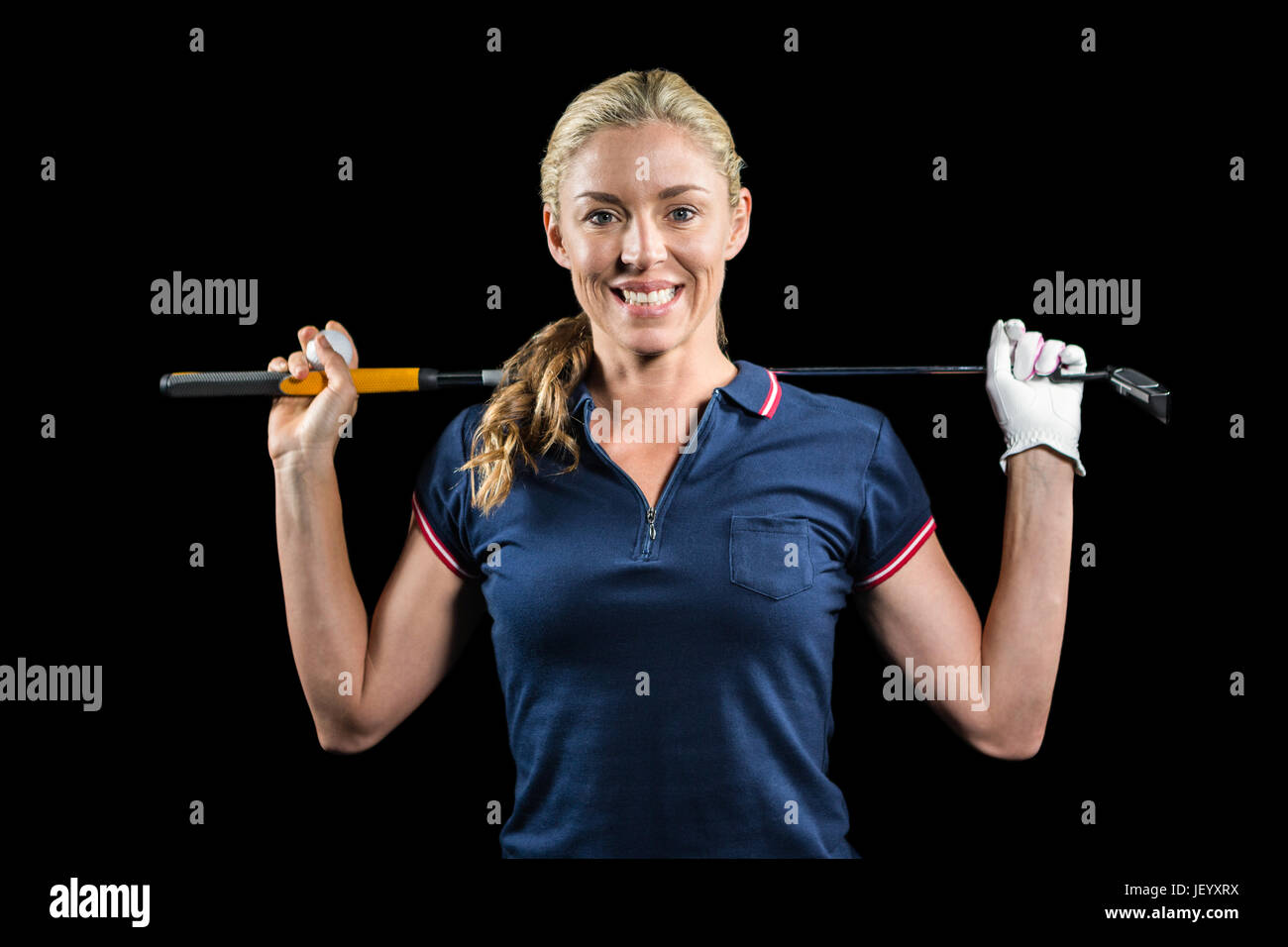 Portrait of golf player holding a golf club Stock Photo