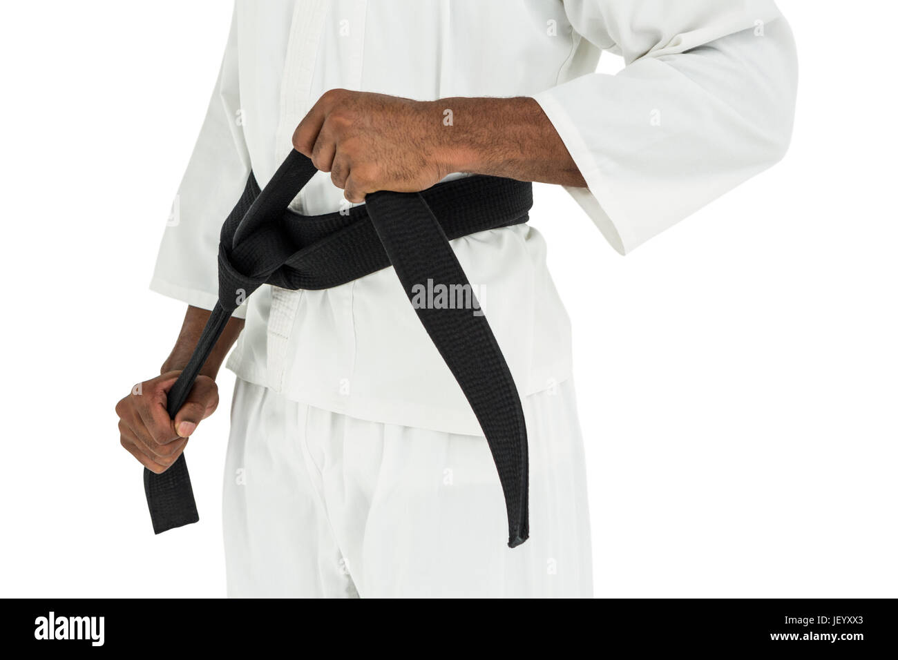 Fighter tightening karate belt Stock Photo Alamy