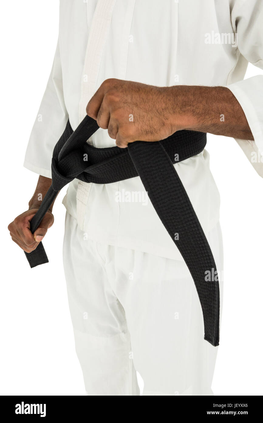 Fighter tightening karate belt Stock Photo Alamy