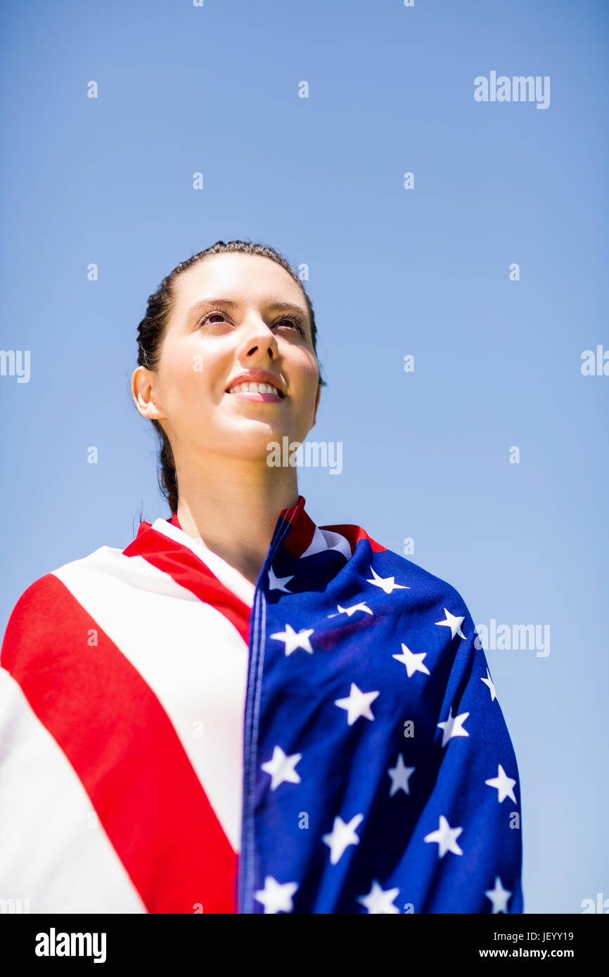 Female athlete wrapped in american flag Stock Photo - Alamy