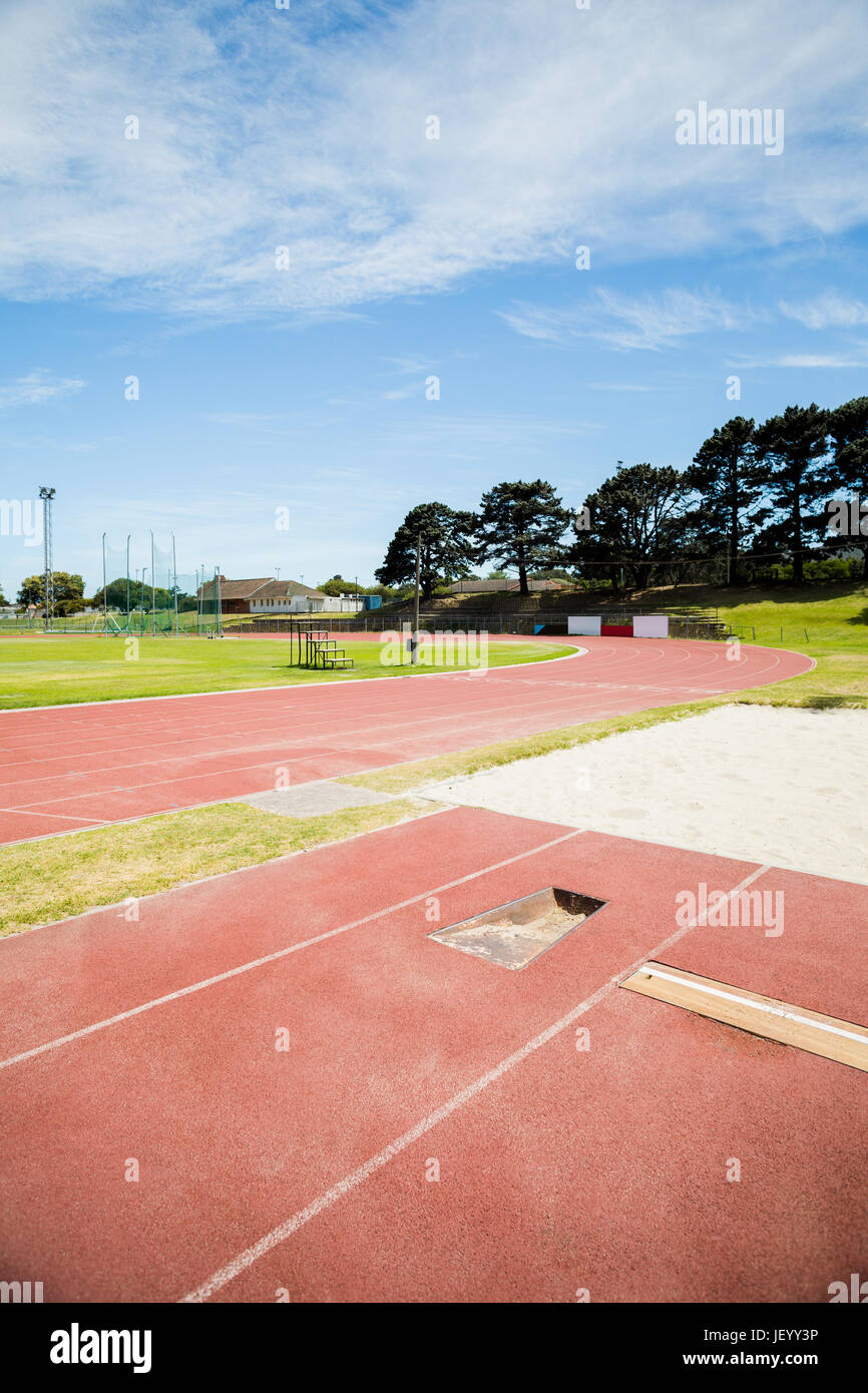 Long jump sand pit on running track Stock Photo
