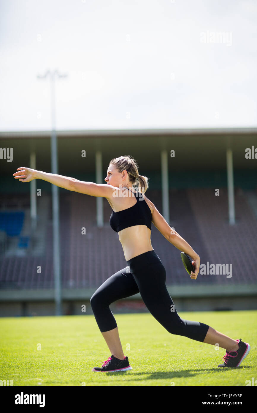 Female athlete about to throw a discus Stock Photo Alamy