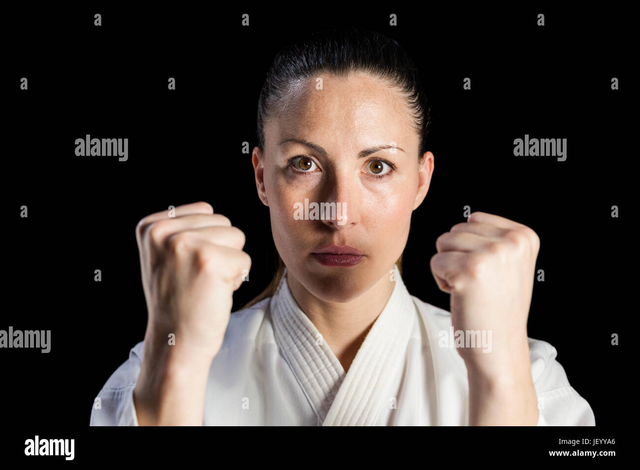 Female fighter performing karate stance Stock Photo Alamy