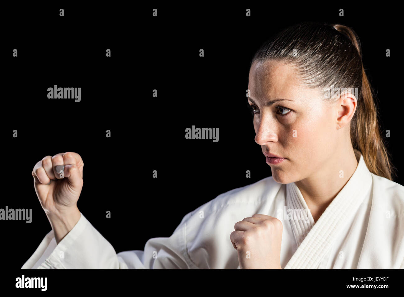 Professional female karate fighter hires stock photography and images