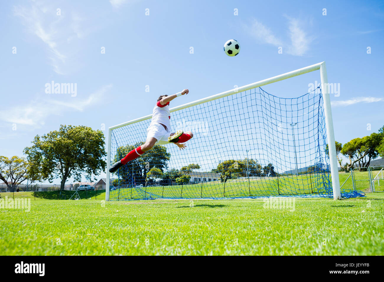 Football player scoring a goal Stock Photo Alamy Football player scoring a goal Stock Photo Alamy