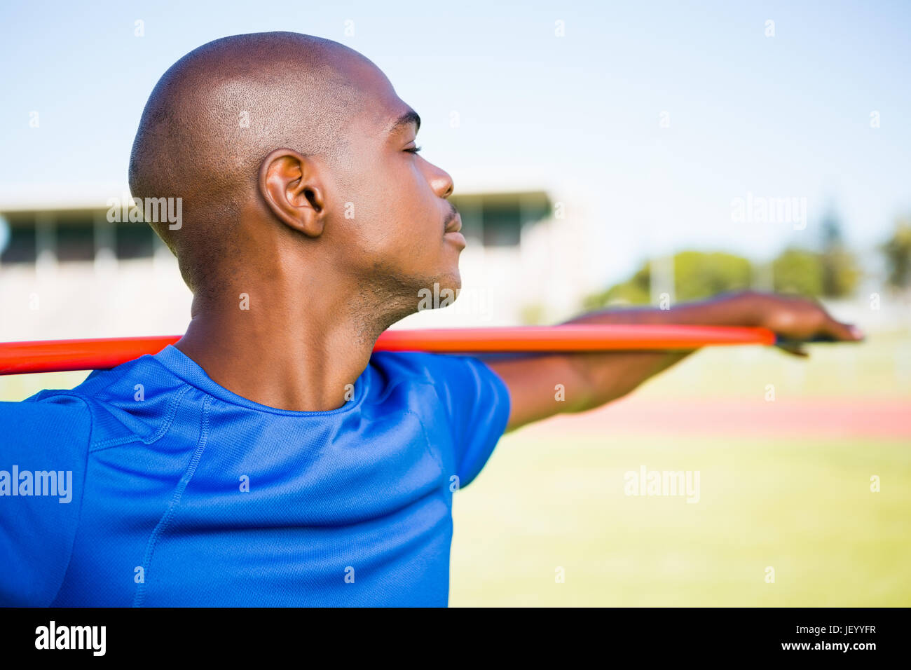 Athlete standing with javelin Stock Photo Alamy