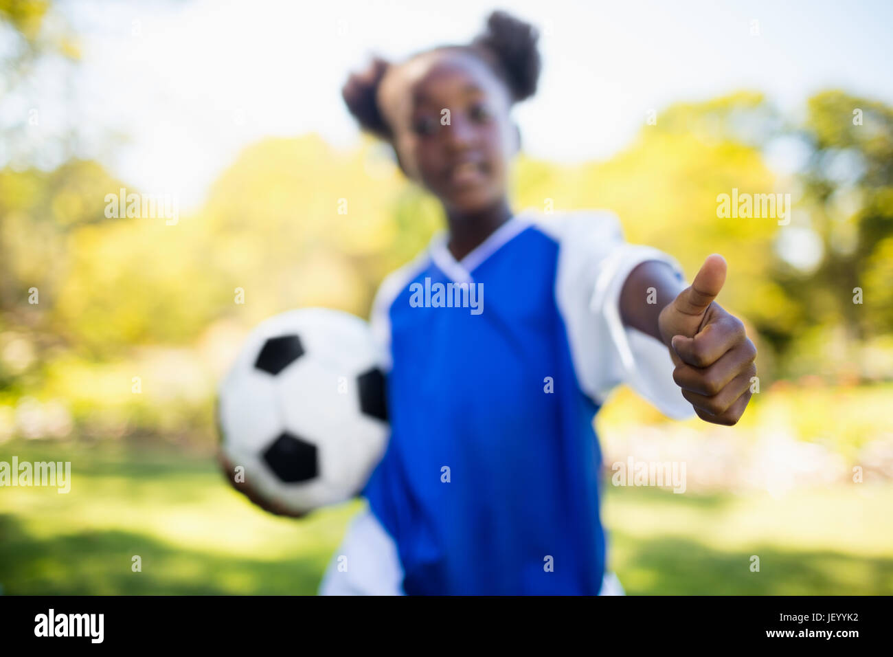 Portrait of girl with thumbs up Stock Photo