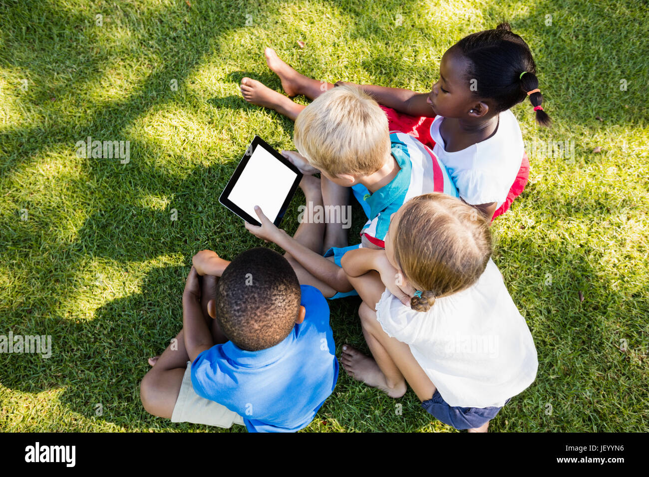 Kid S Using Technology Kids using technology during a sunny day Stock Photo - Alamy