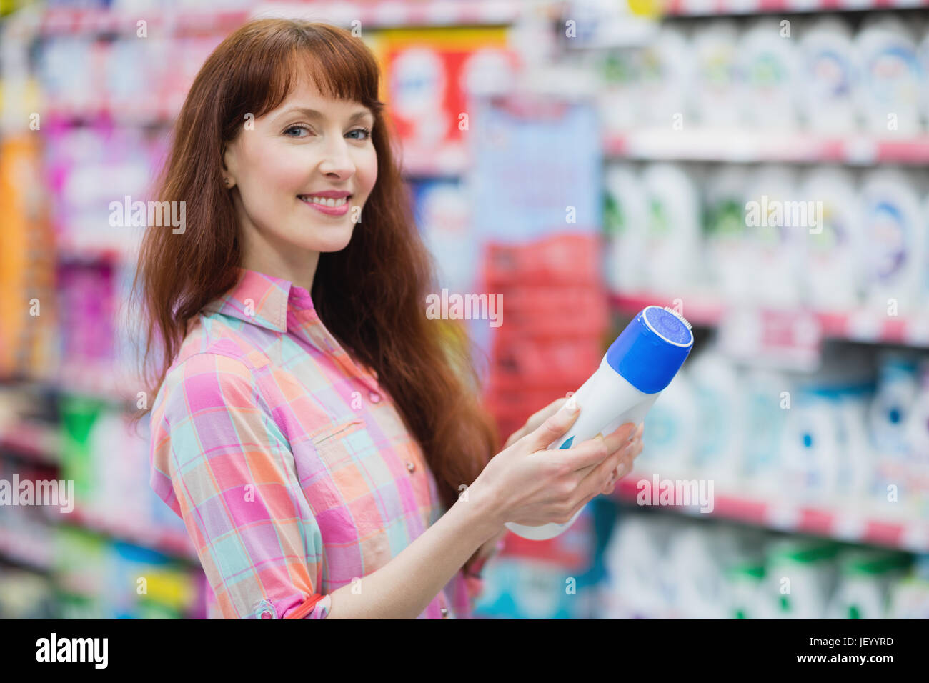 Beautiful woman posing with detergent Stock Photo