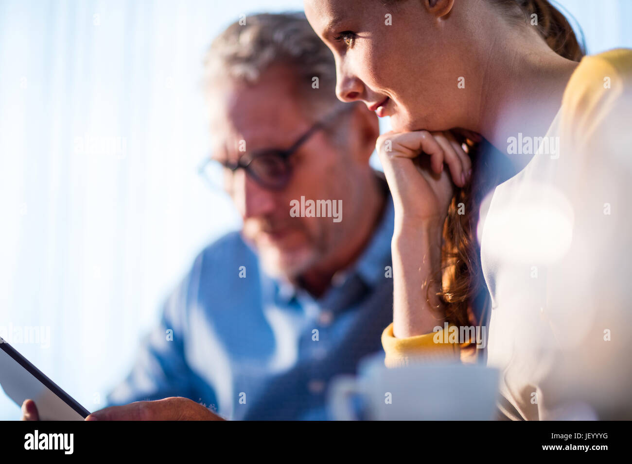 Two businessmen using a tablet computer Stock Photo