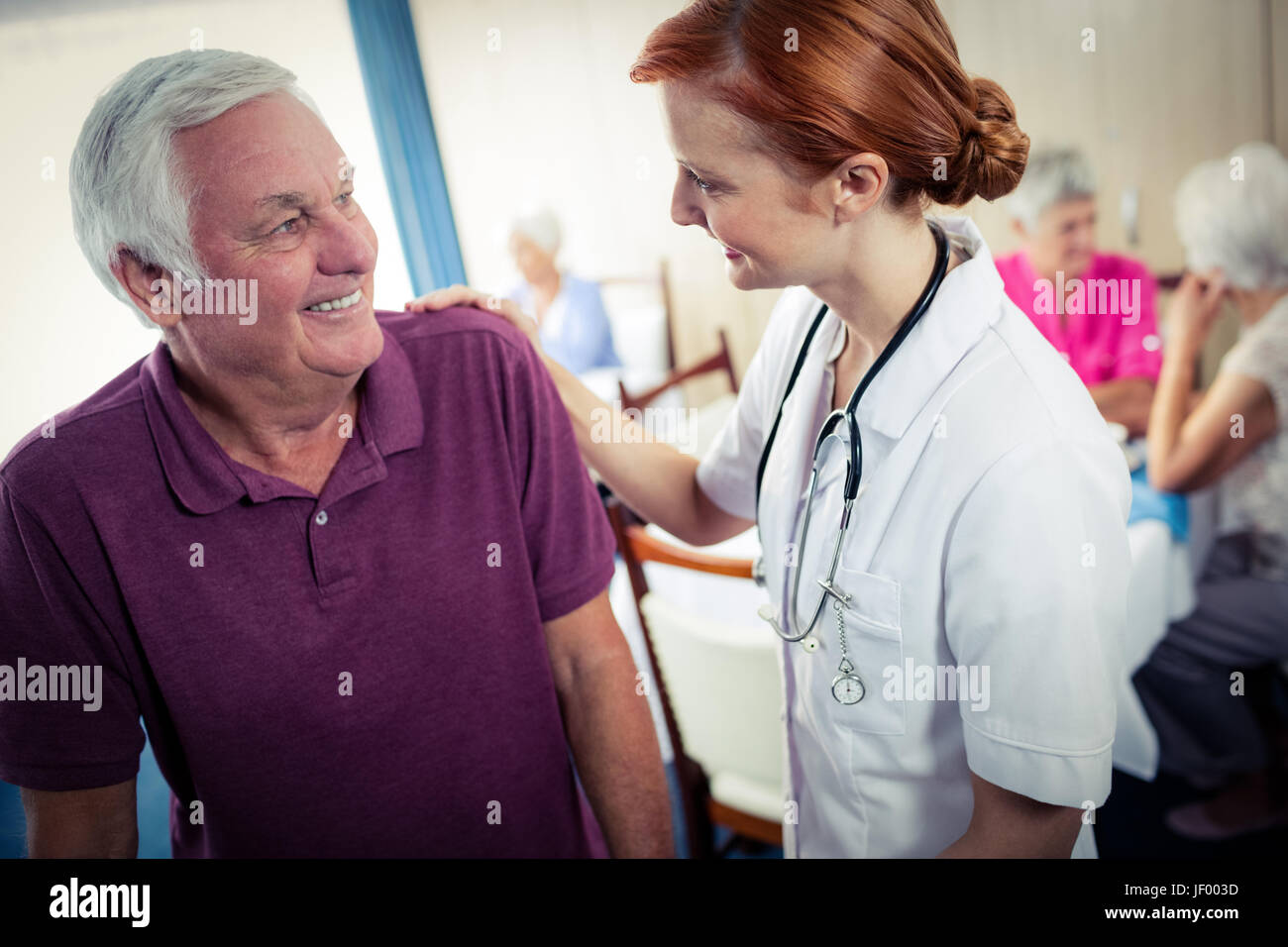 Nurse assisting a senior Stock Photo