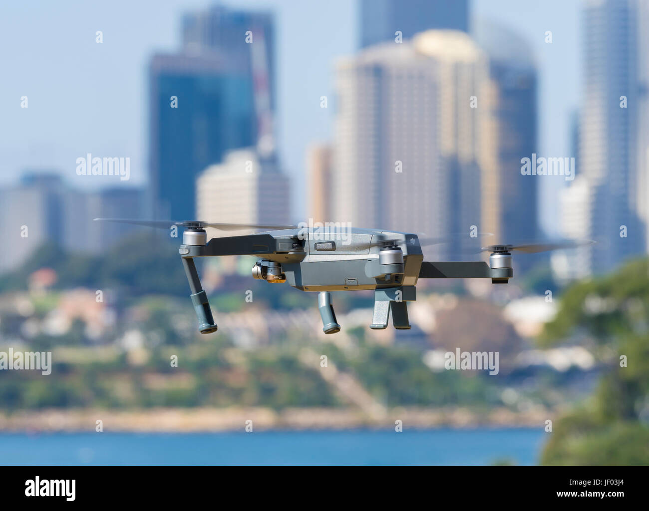 Drone flying near city centre Stock Photo