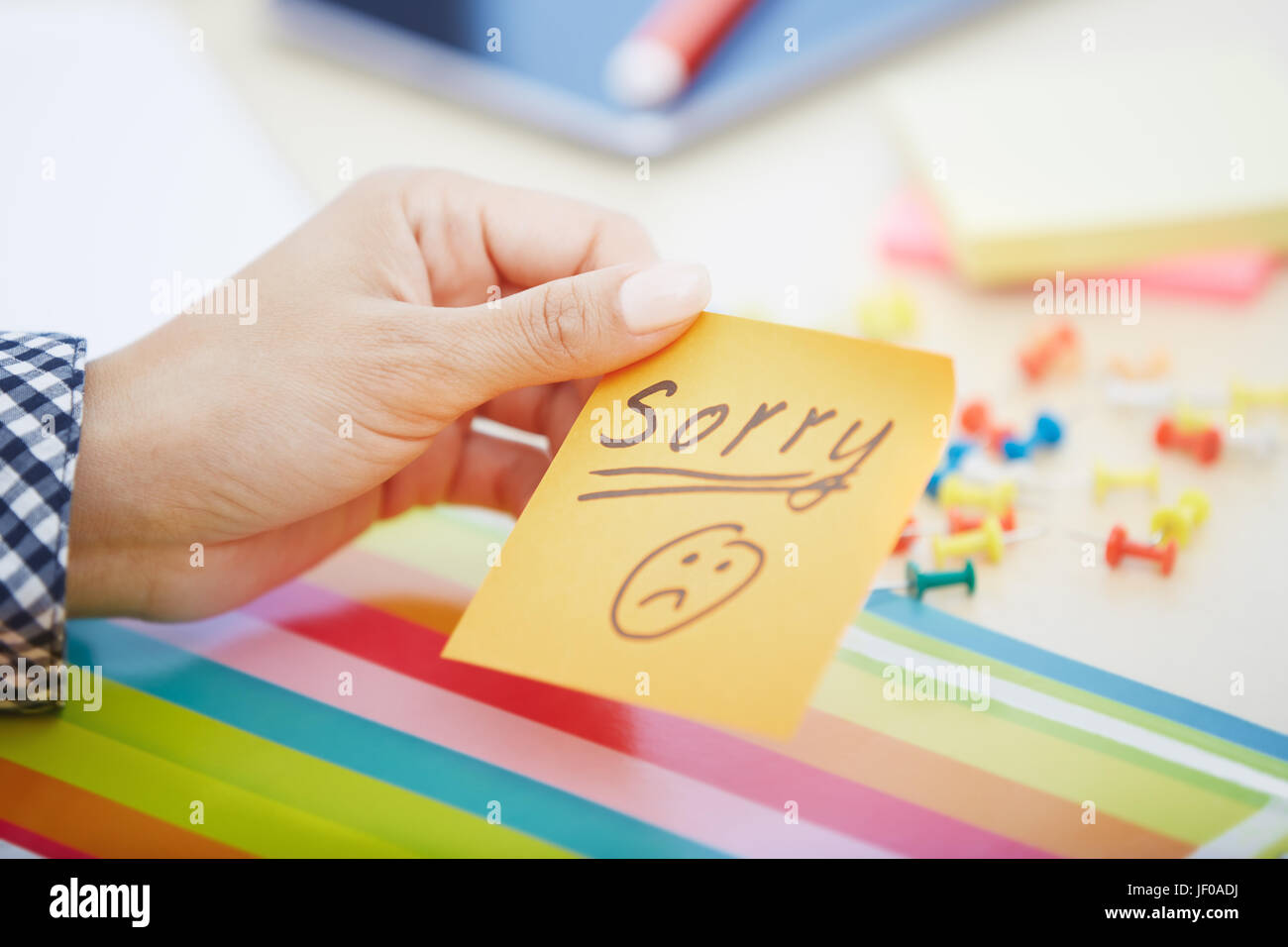 Unfortunately Note Sorry text on adhesive note Stock Photo - Alamy