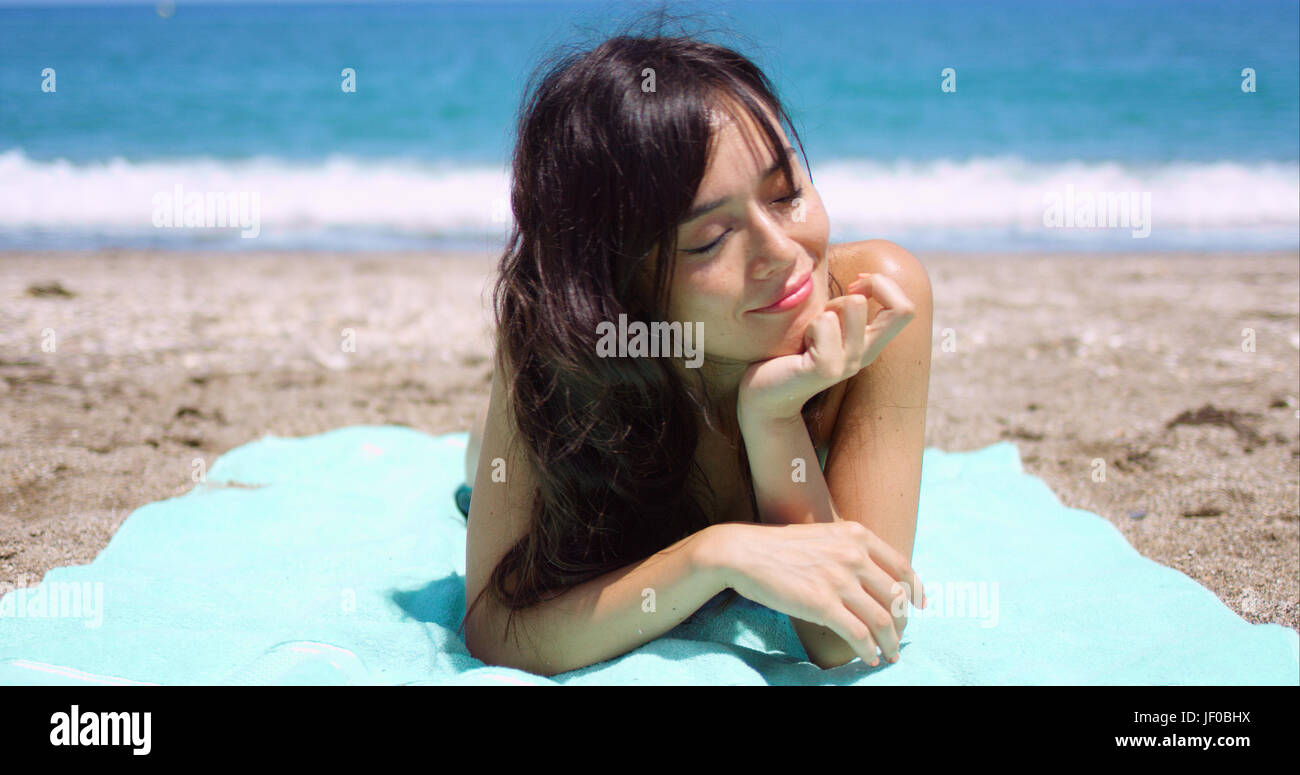 Blissful woman enjoying the summer sun Stock Photo