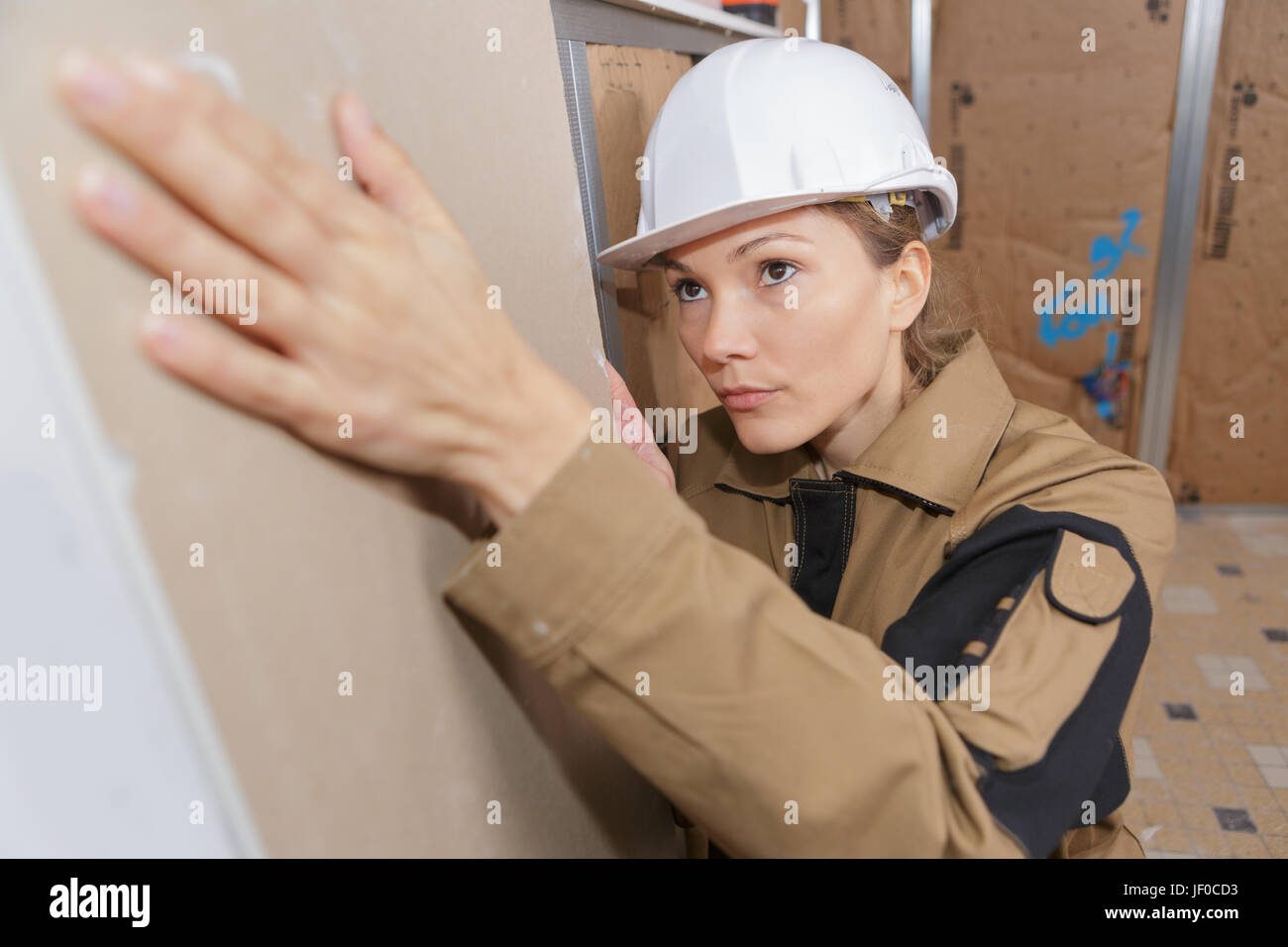 young female builder working indoors Stock Photo Alamy