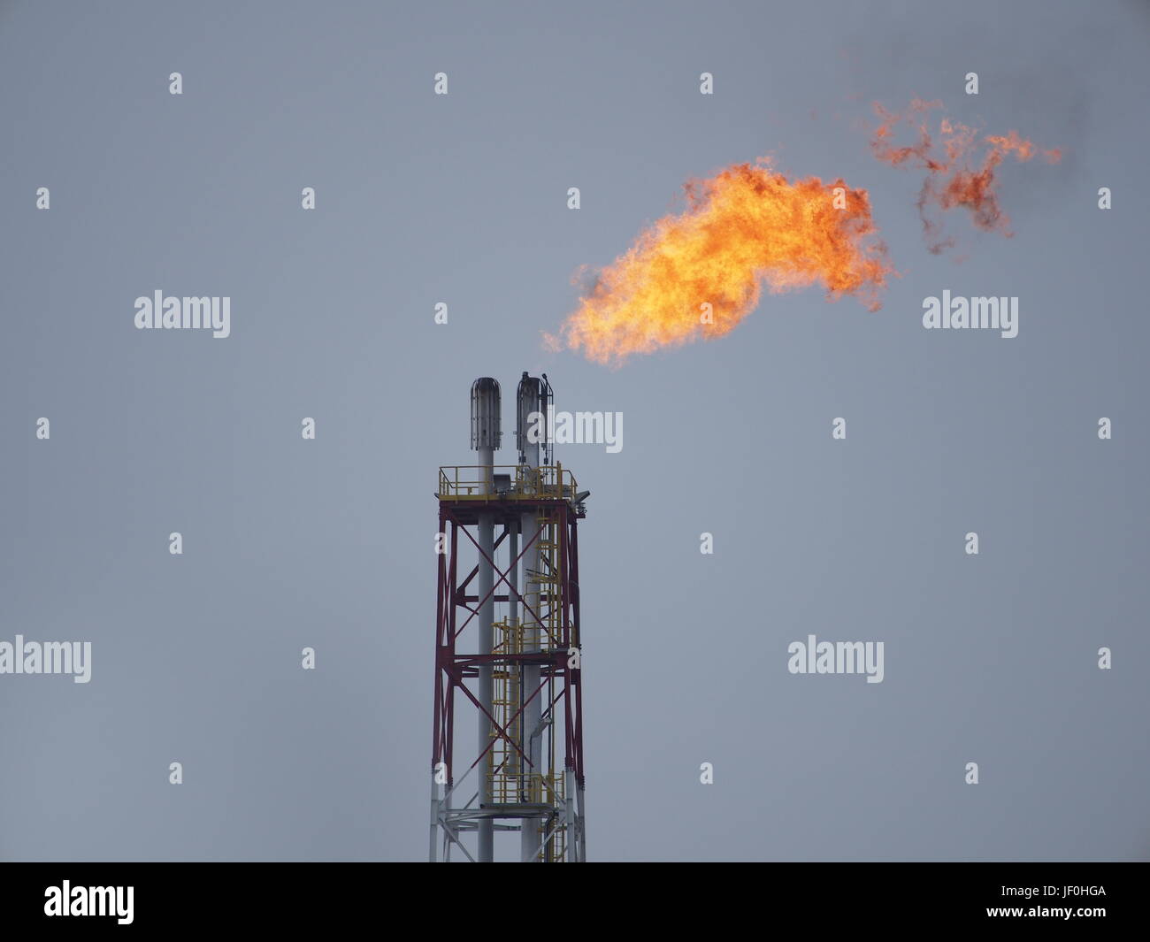 refinery fire gas torch on sky background Stock Photo - Alamy