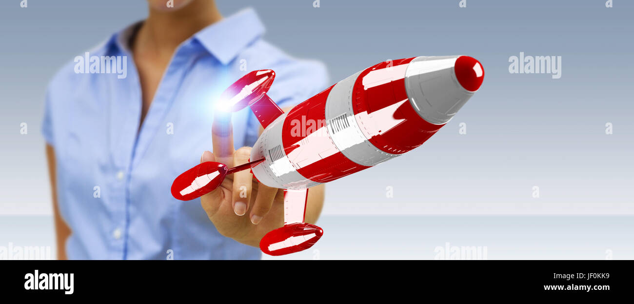 Businessman on blurred background holding red rocket in his hand 3D rendering Stock Photo