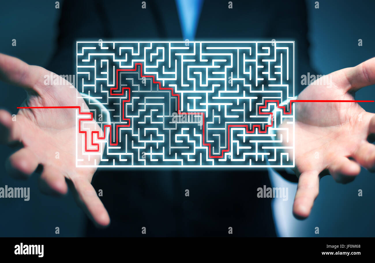 Businessman on blurred background searching solution of a complicated maze Stock Photo