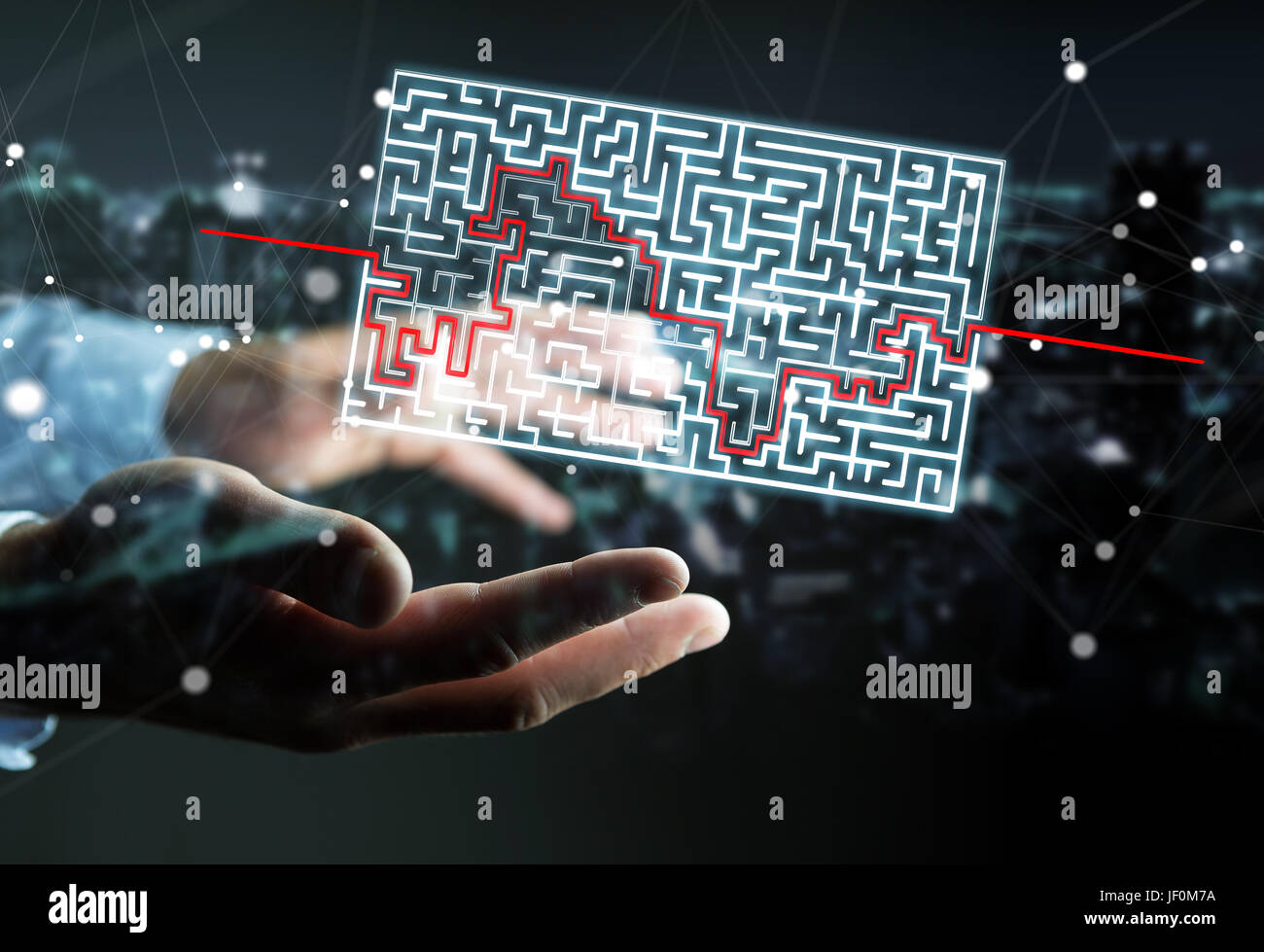 Businessman on blurred background searching solution of a complicated maze Stock Photo