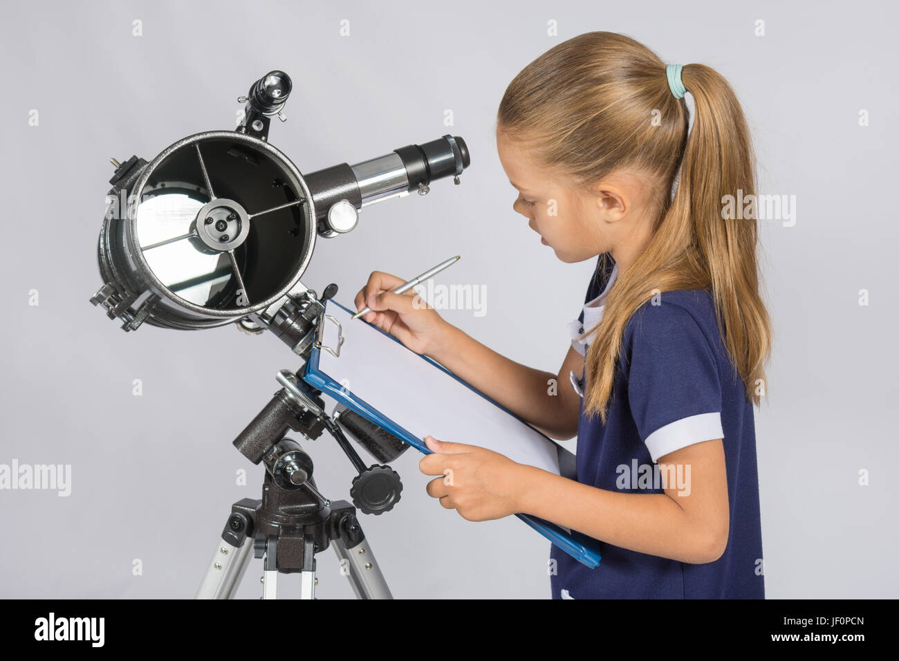 Astronomer writes observations Stock Photo