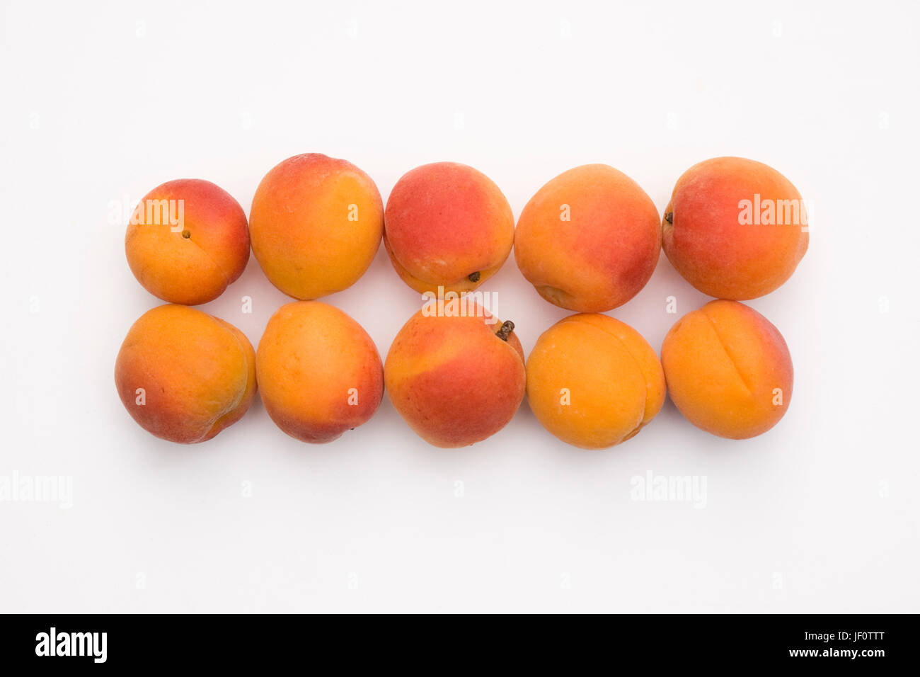 Prunus armeniaca. Fresh Apricots on a white background. Stock Photo