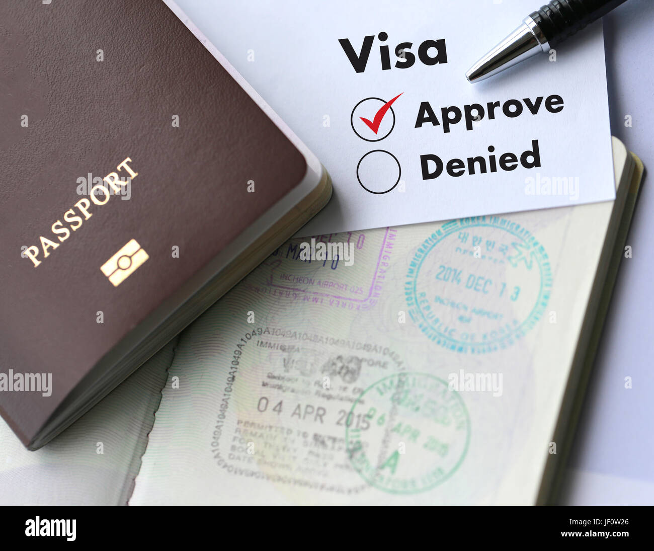 Visa and passport to  approved stamped on a document top view in Immigration Stock Photo