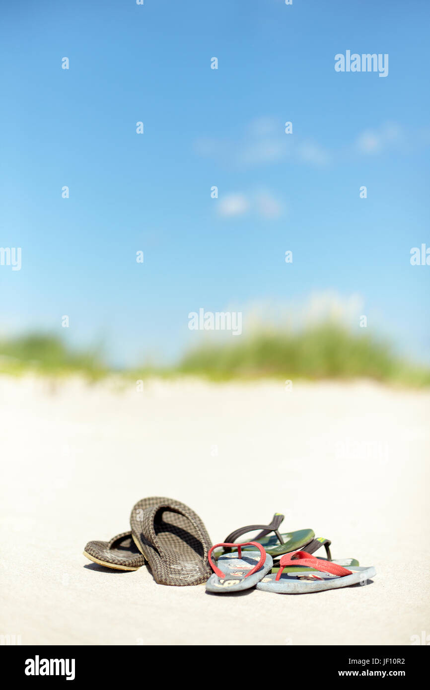 Flip flops on beach Stock Photo - Alamy