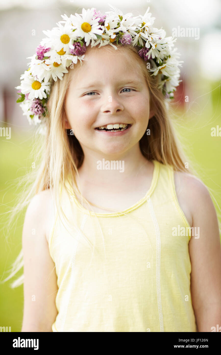 Girl wearing flower wreath Stock Photo - Alamy