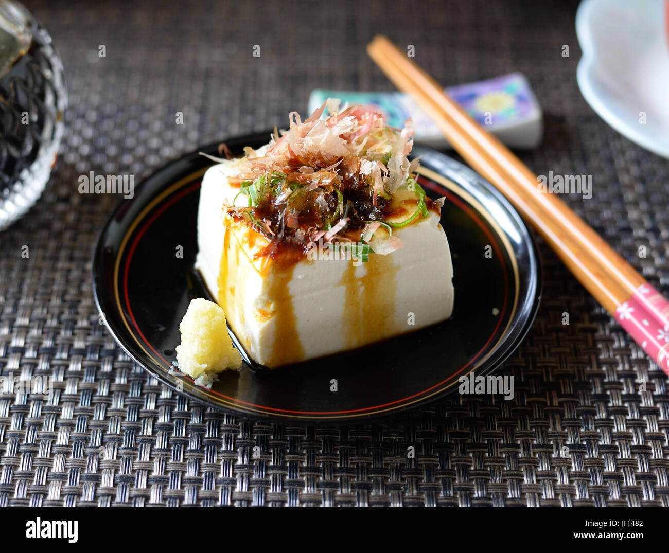 Closeup of hiyayakko--Japanese cold tofu salad--on a black background. Stock Photo