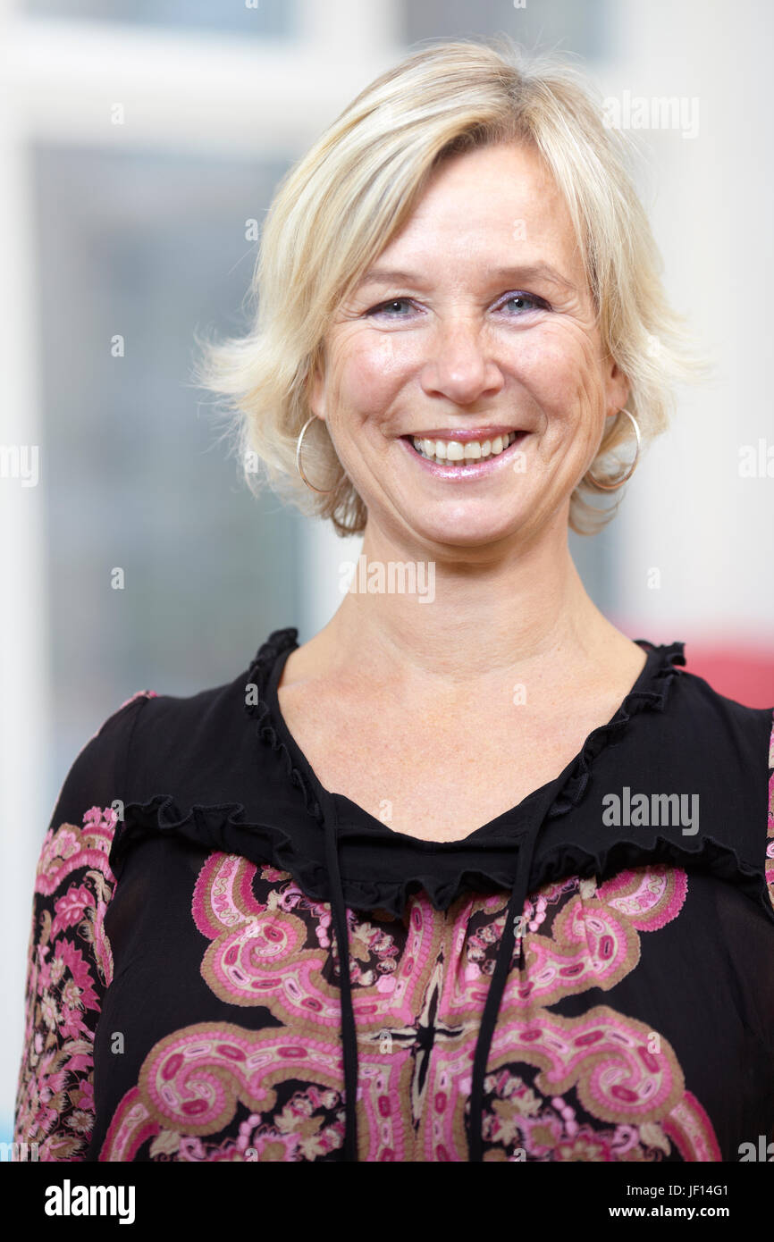 Portrait of smiling mature woman Stock Photo - Alamy