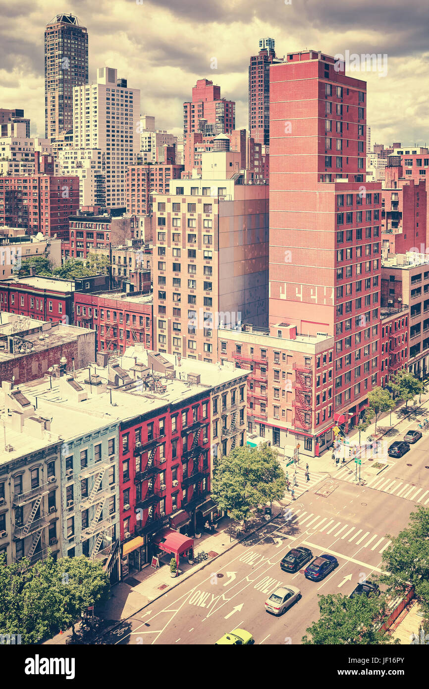 Vintage stylized picture of the famous First Avenue and city skyline on the Upper East Side, looking north from the Roosevelt Island, New York, USA. Stock Photo