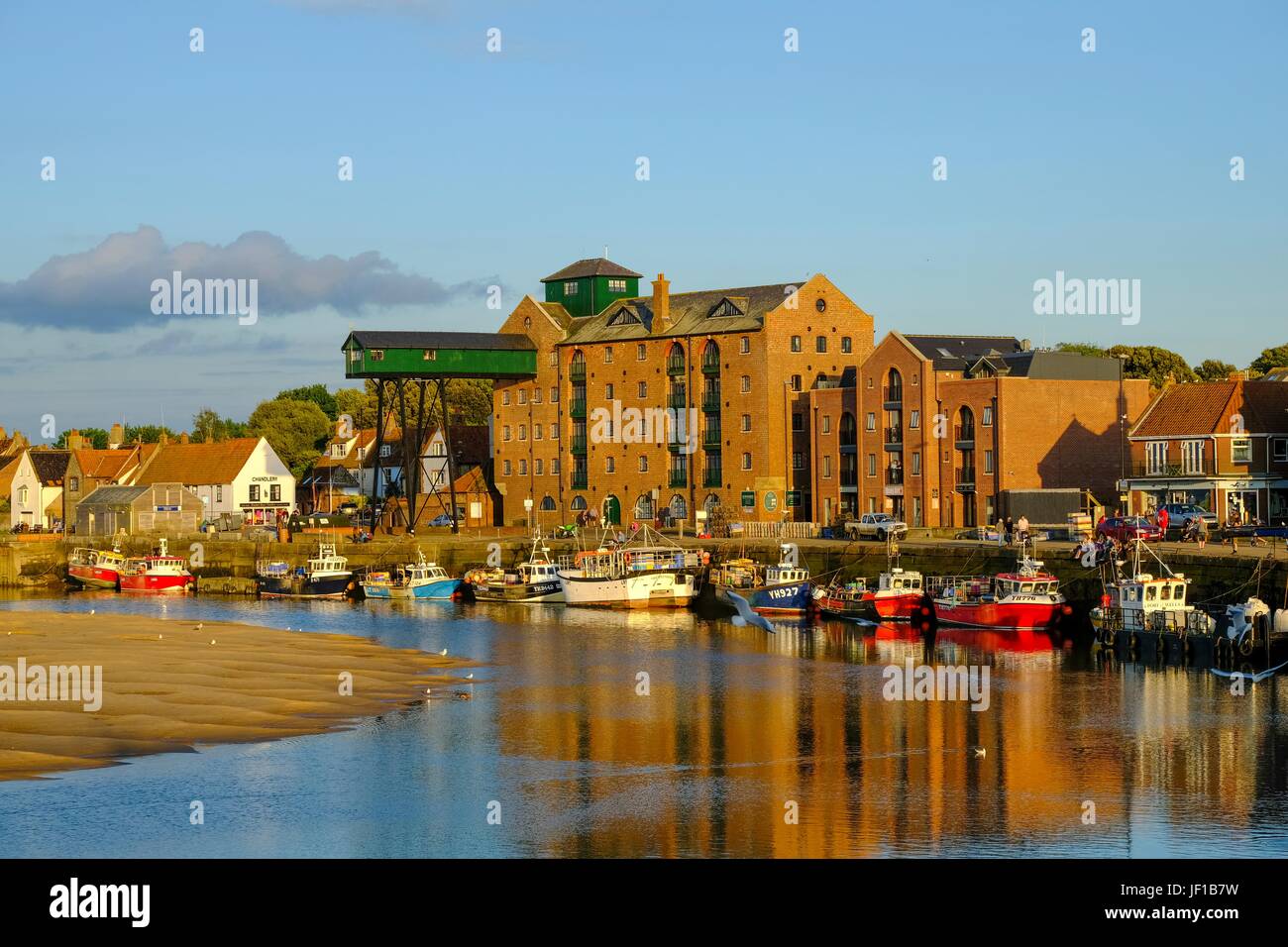 View of the Quay at Wells next the sea showing the old maltings complex. Stock Photo