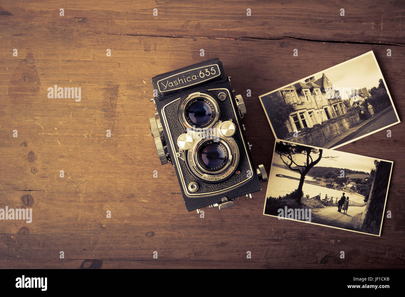 classic Yashica photo camera and vintage photographs Stock Photo