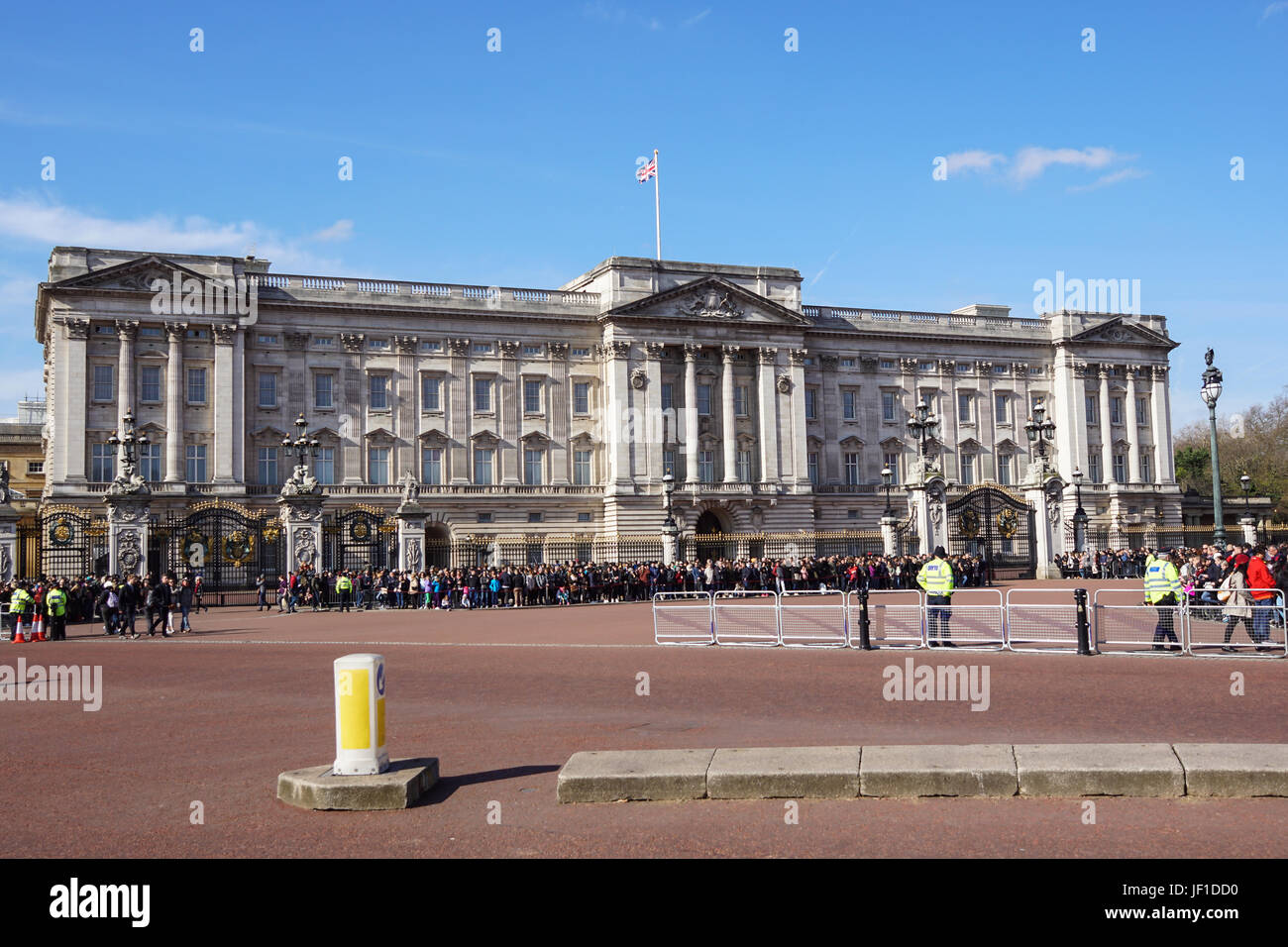 LONDON, UK - April 06 2017 : Crowds gather outside Buckingham Palace to watch the changing of the guard ceremony. Stock Photo