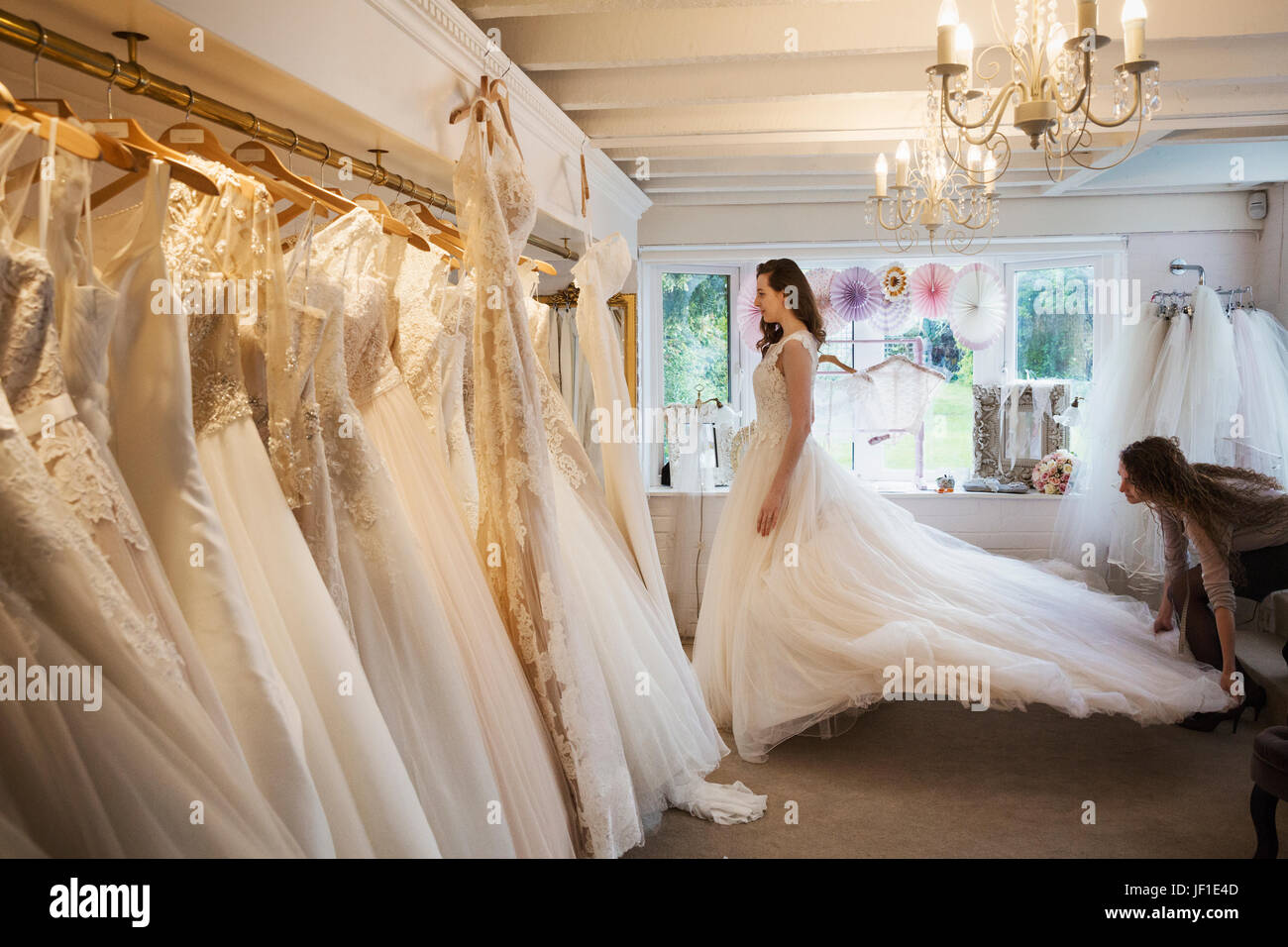 Rows of wedding dresses on display in a specialist wedding dress shop