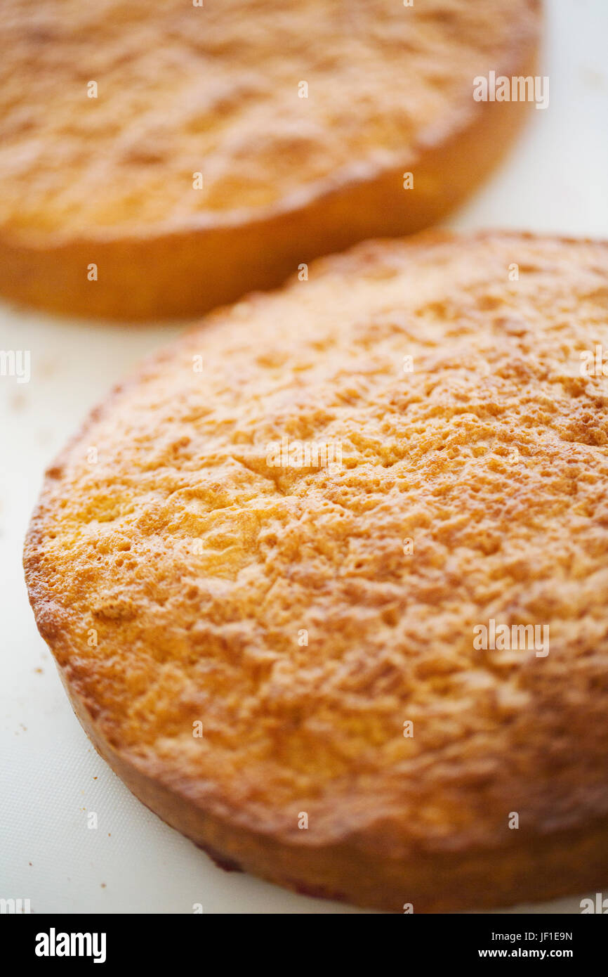 Close up high angle view of two layers of freshly baked raspberry cake. Stock Photo