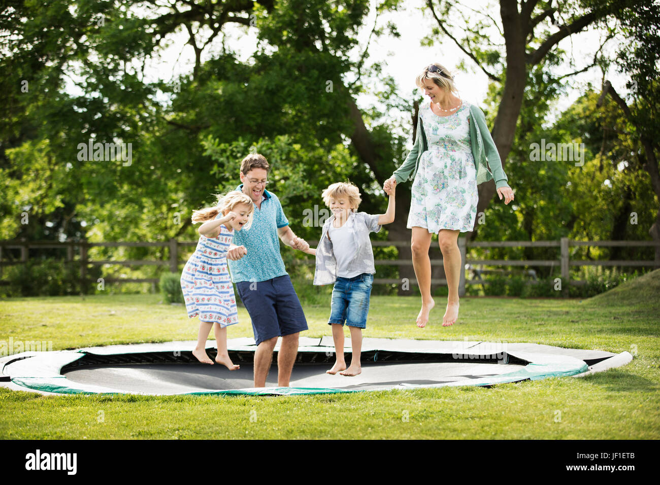 Two girls on a trampoline hi-res stock photography and images - Alamy