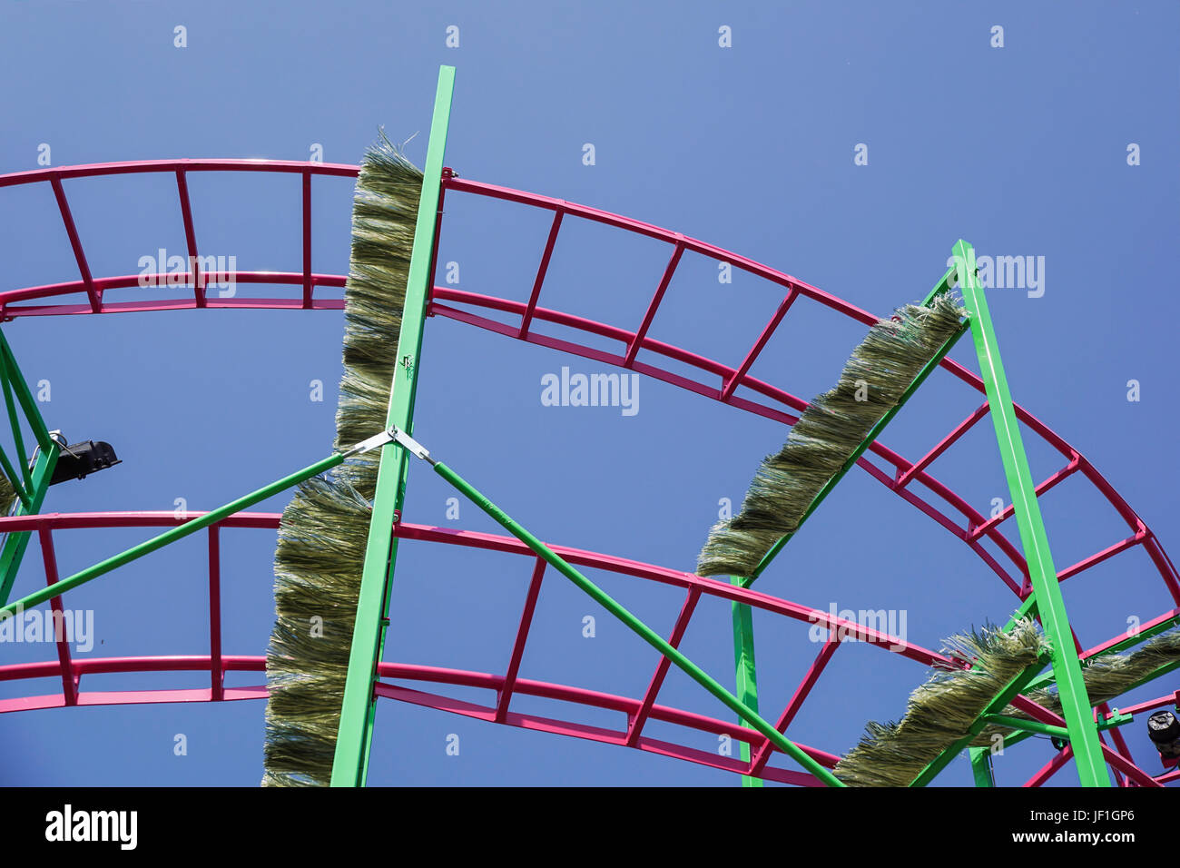 Rollercoaster track rail against a brilliant blue sky Stock Photo