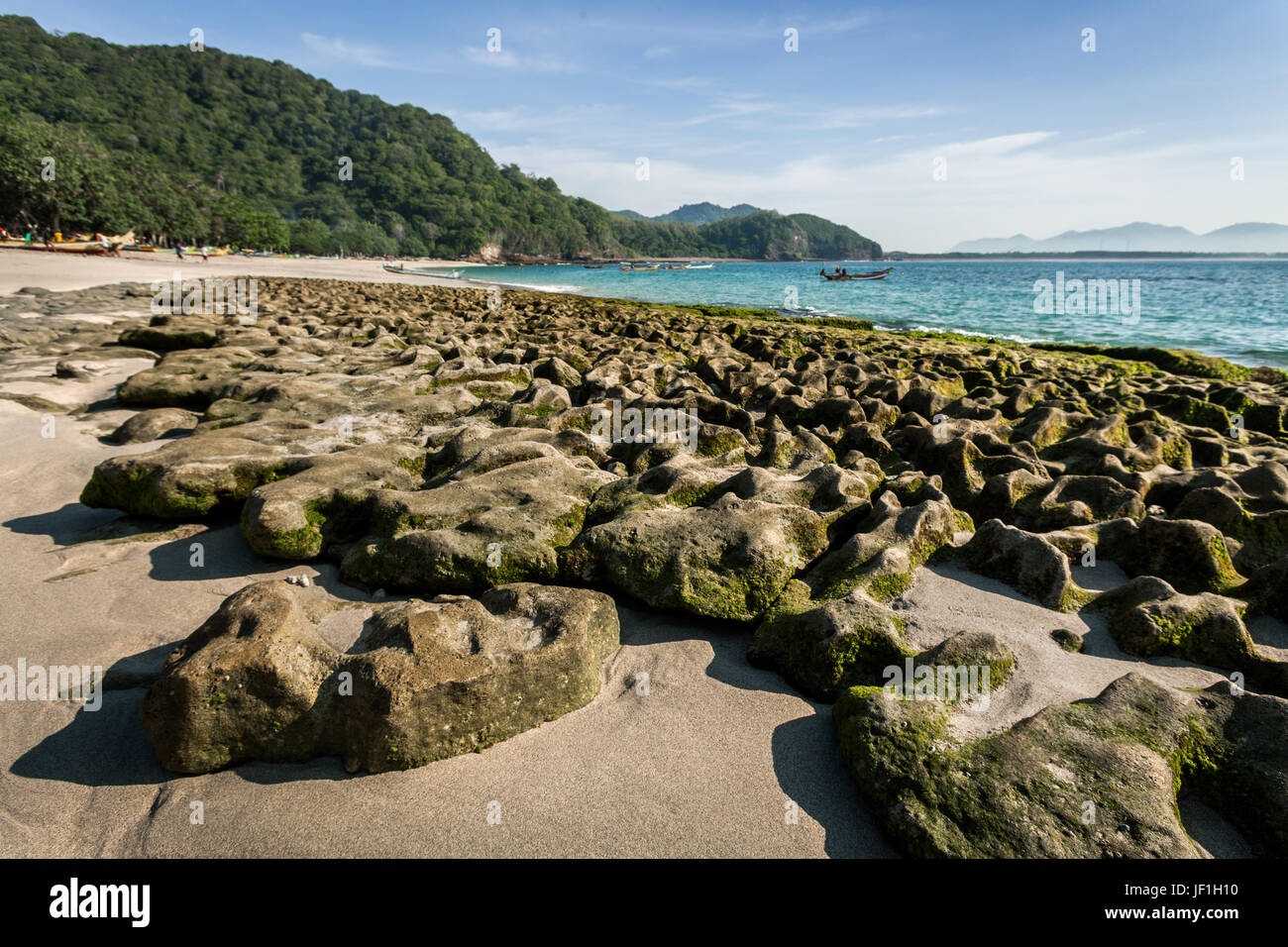 Odd and unusual rock formation at Papuma beach in the area around Tanjung Papuma. Tanjung Papuma is more famously known for Papuma rock sea stack Stock Photo