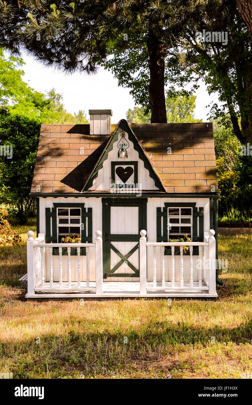 Small house in a garden Stock Photo