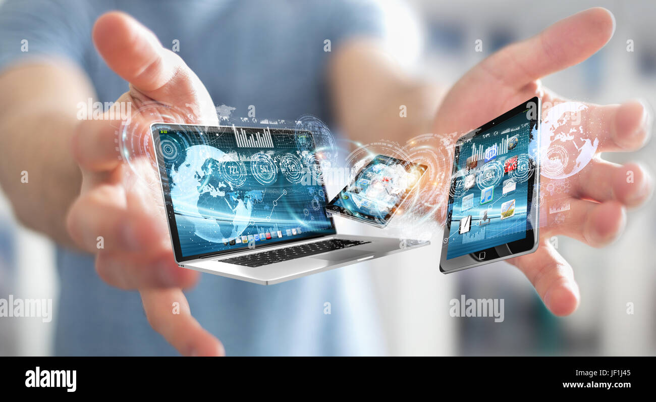 Businessman on blurred background connecting tech devices 3D rendering Stock Photo