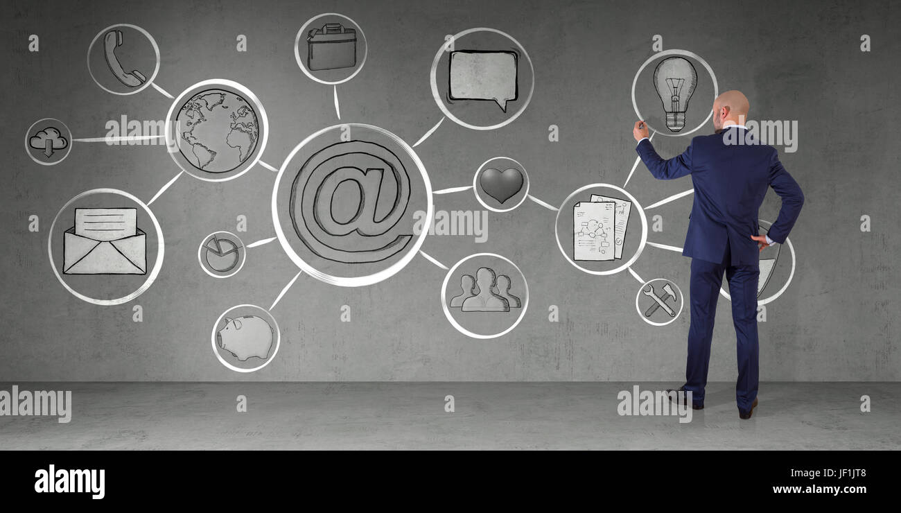 Businessman in modern interior drawing multimedia interface sketch on a wall 3D rendering Stock Photo