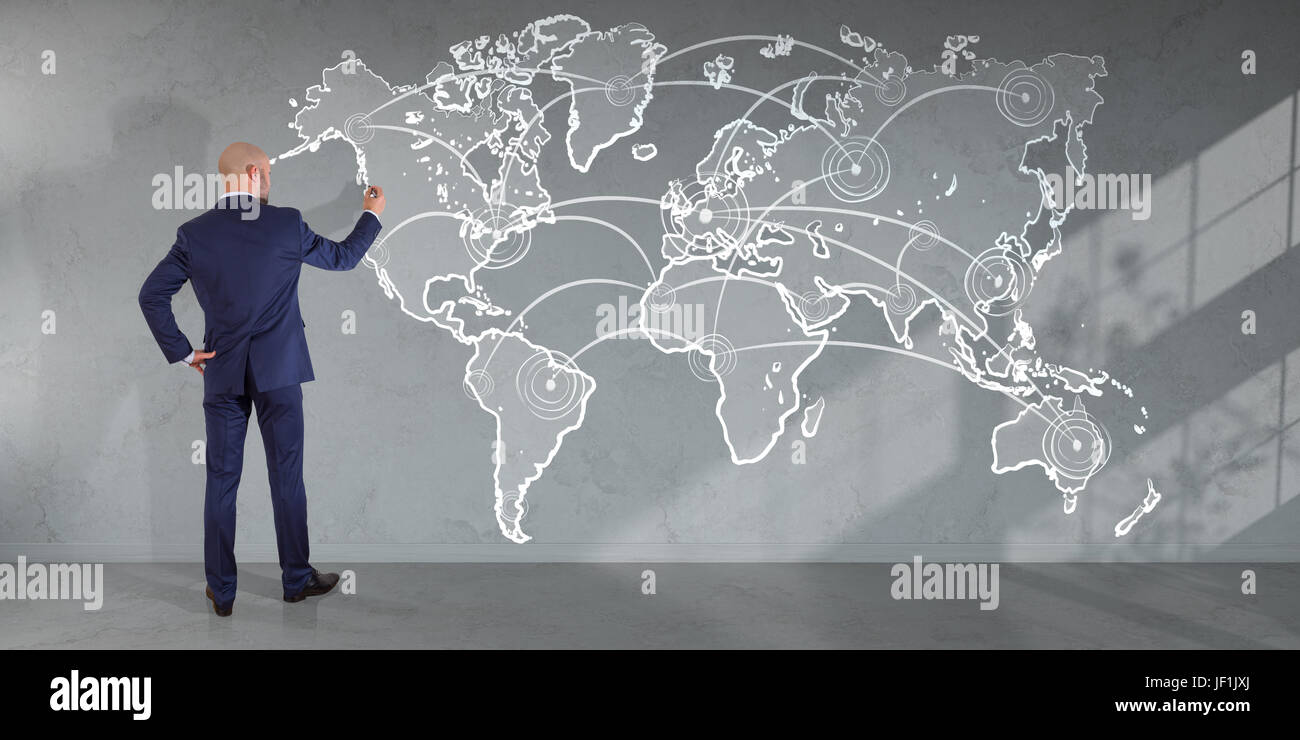 Businessman in modern interior drawing manuscript world map connection on a wall 3D rendering Stock Photo