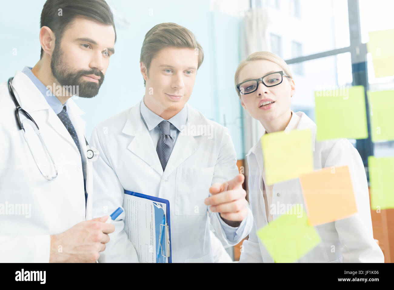 group of concentrated doctors having work meeting in clinic Stock Photo