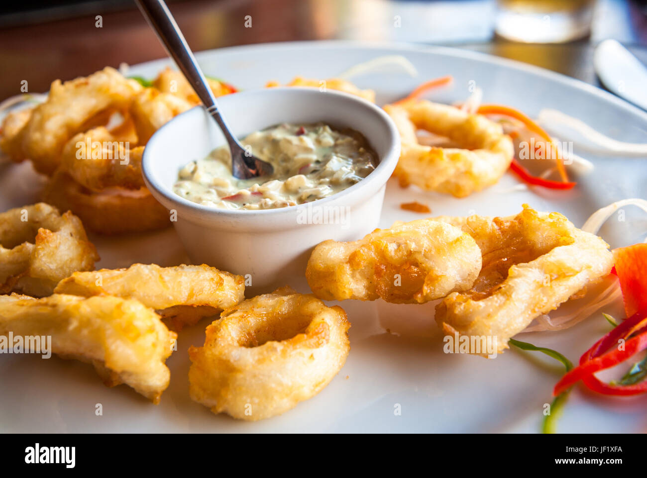 Deep fried calamari rings with sauce bowl Stock Photo Alamy