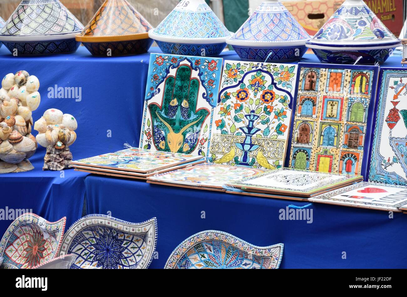 Bright ceramic tiles on sale on stall Stock Photo Alamy
