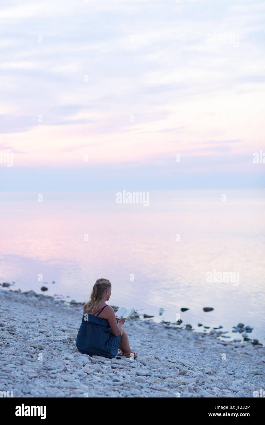 Woman looking at sea Stock Photo - Alamy