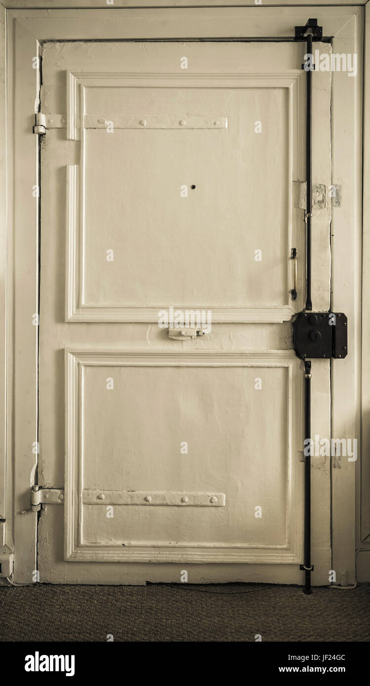 Old door with a massive lock Stock Photo