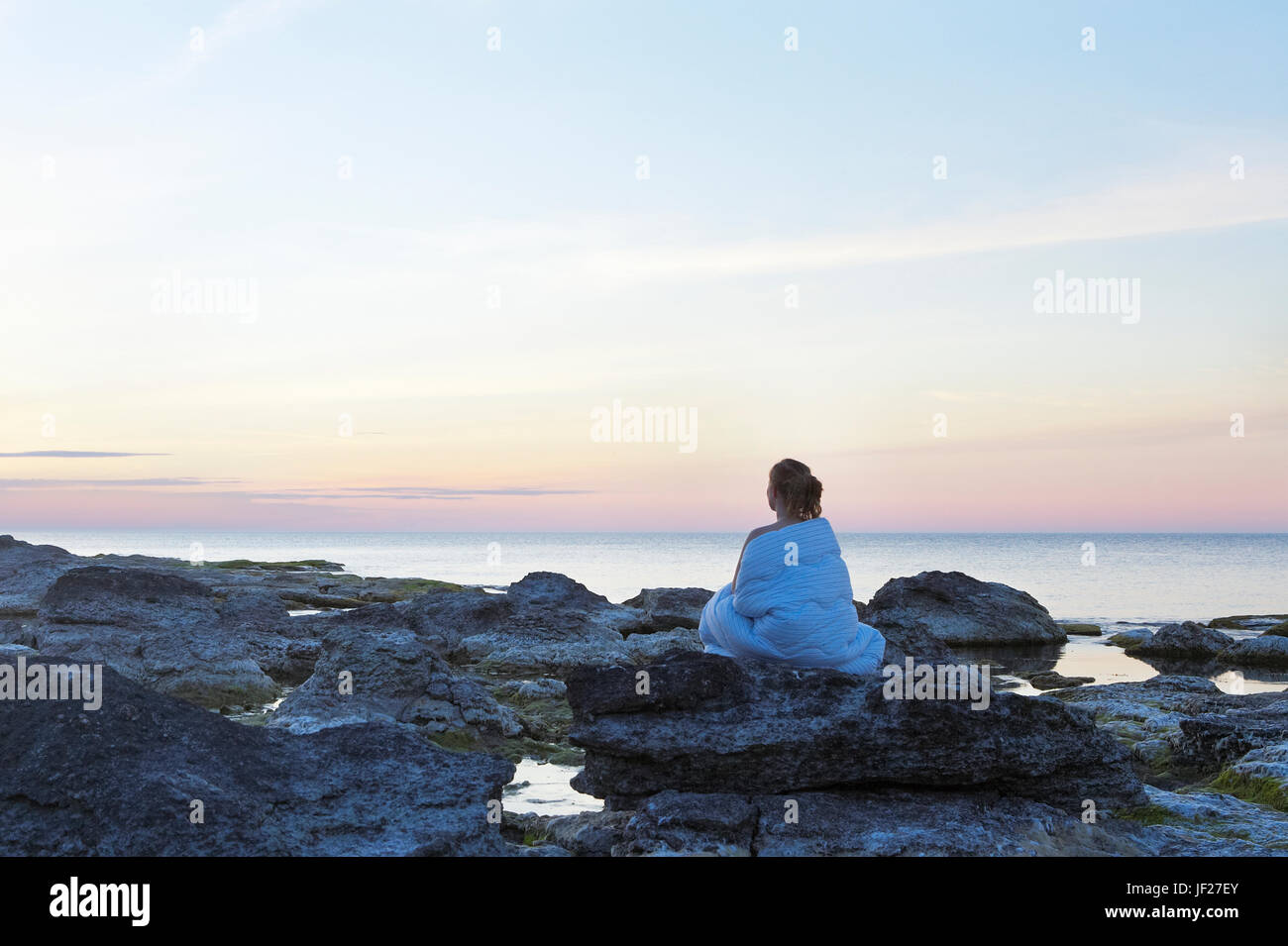 Woman looking at sea Stock Photo - Alamy