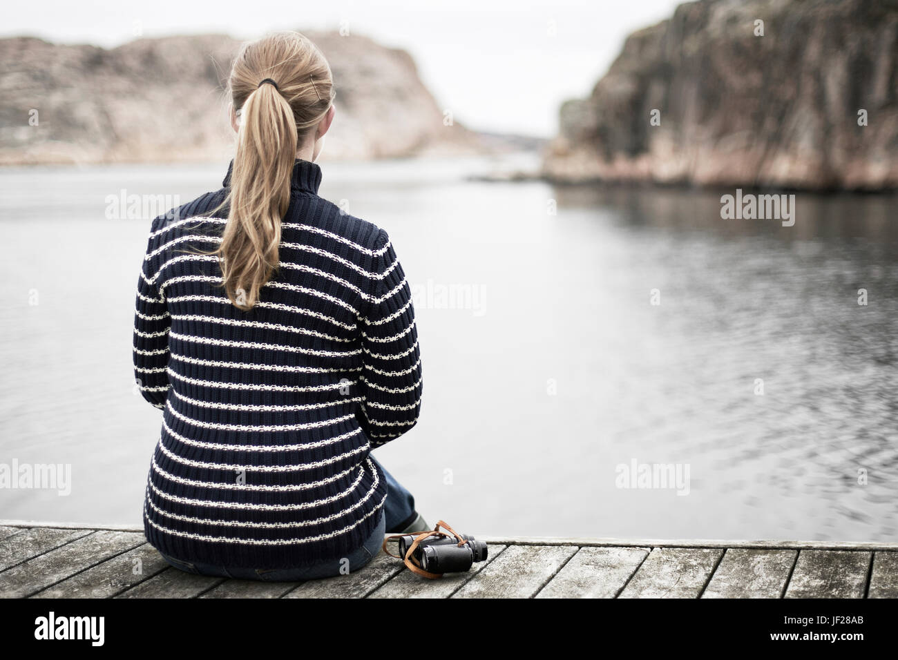 Woman looking at sea Stock Photo - Alamy